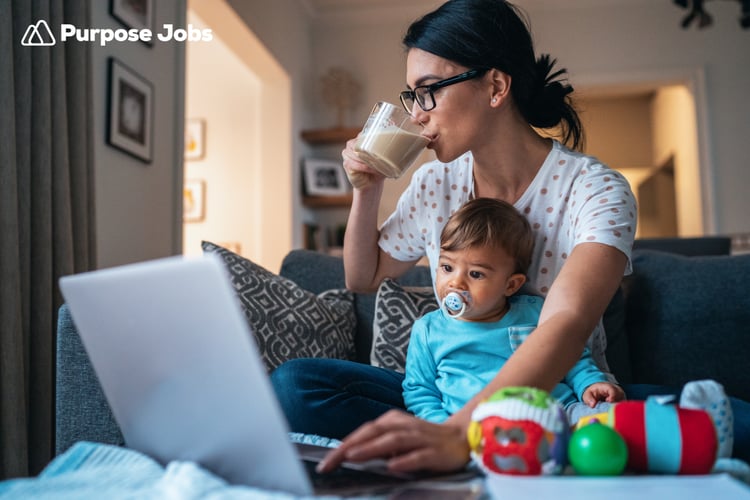 Image of mother working from home with toddler on her lap
